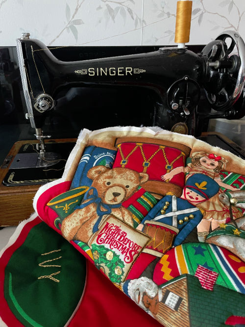 vintage sewing machine with a personalised christmas stocking